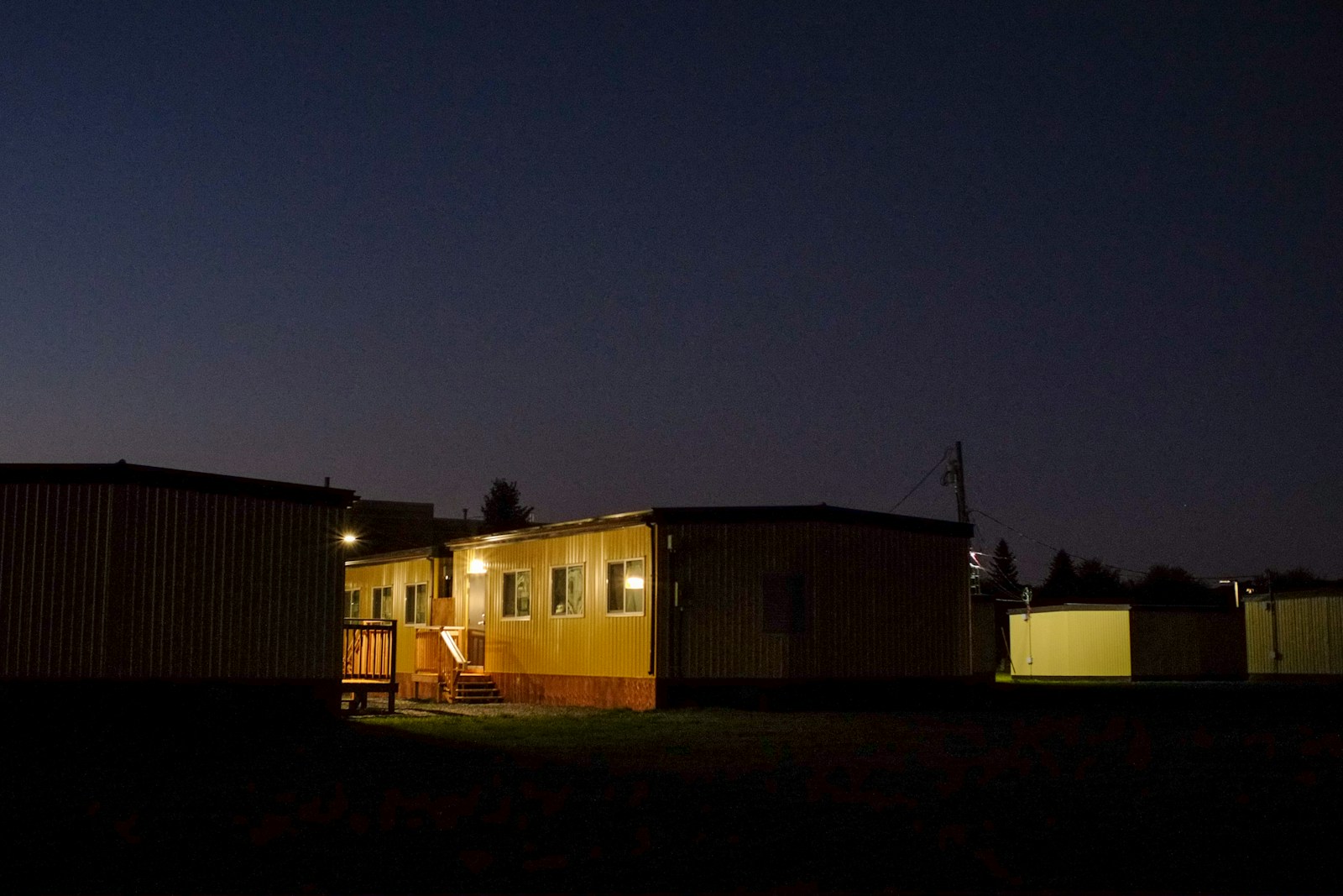 Temporary buildings illuminated at dusk